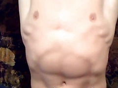 Muscled twink Alick rubs down his finely-tuned physique for the camera