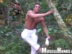 Bodybuilder posing outdoors. MH men.
