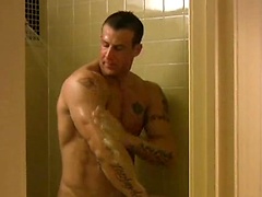 Muscle man Tony Cage takes a shower
