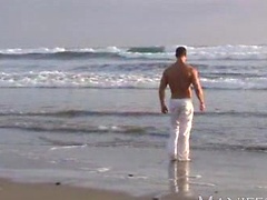 Vic Rocco naked on a beach