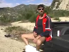 Filthy horny stud enjoys wanking off and peeing outside here