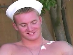 Sexy blond sailor stud masturbating his horny cock outside