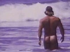 At the beach, an exhibitionist is showing his sexy curves