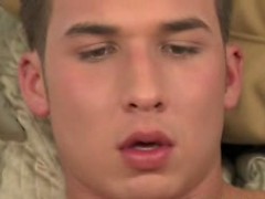 Young kinky guy masturbating on his bed after an interview