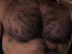 Mega hairy hunk Aaron Action strokes his thick uncut manmeat