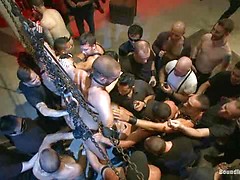 Southern stud gets fucked and showered with cum in front of 100 men!